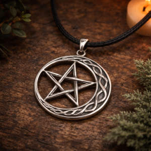 crescent moon pentagram pendant necklace lying on a rustic table