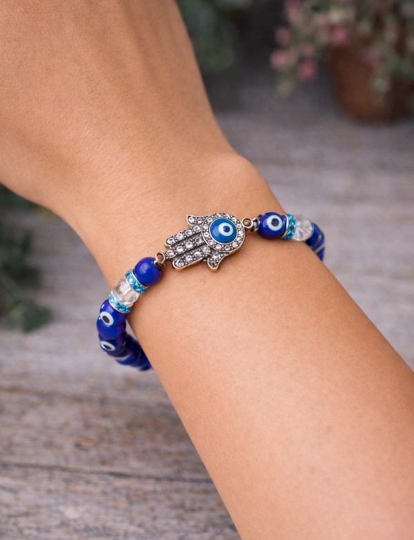 Evil Eye Quartz Bracelet with Hamsa Hand on hand